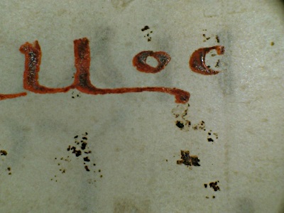 Detail of a dense red ink used for the text